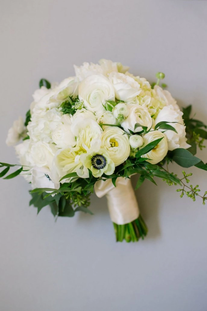 All-white bridal bouquet with anemones