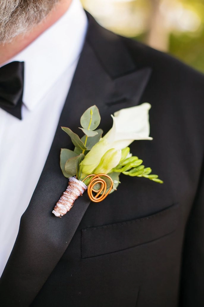 White calla lily boutonnière with copper wire